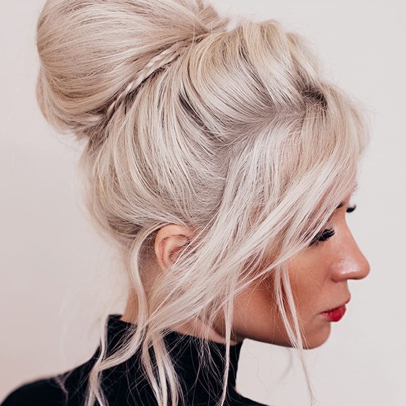 Women's blonde hair updo styling